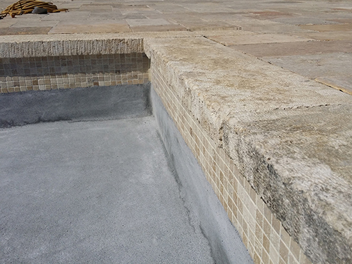 Antique Stone Pool Coping Slabs Milled at 2.5" in Thickness Installed in a pool in a Custom Home in Newport Beach